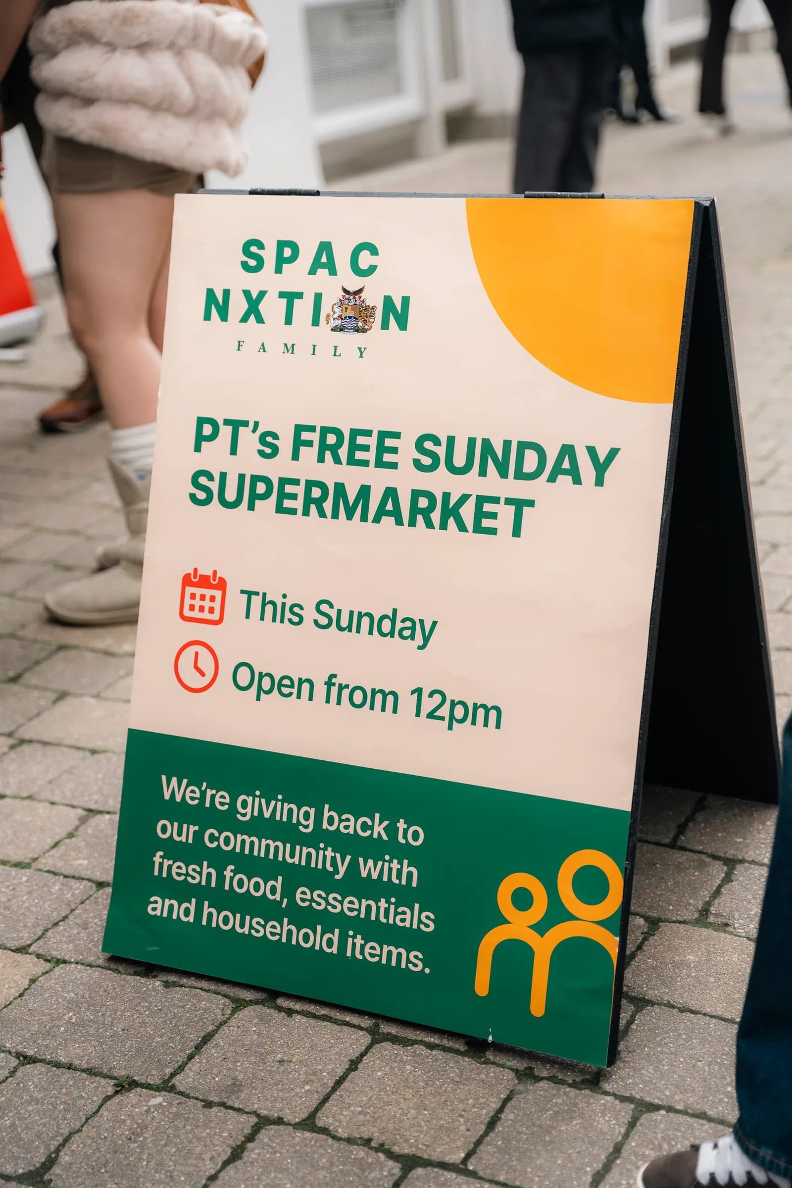 A sign advertises PT's Free Sunday Supermarket outside the SPAC Nxtion Community event in Wandsworth, 18 October 2026.